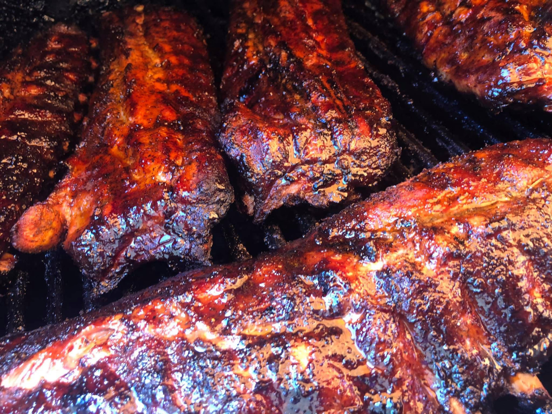 Glazed smoked ribs resting in the smoker