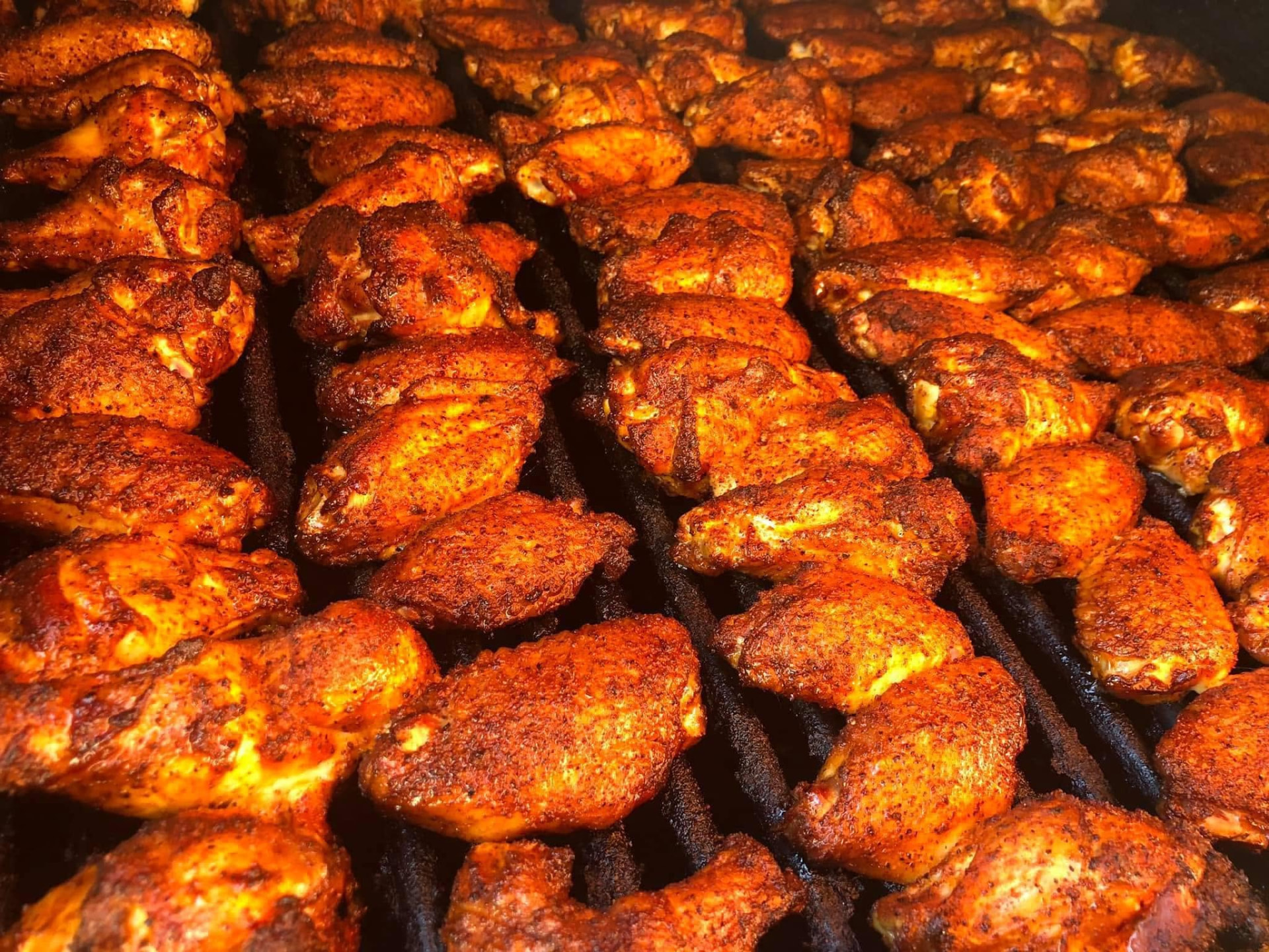A full smoker rack of seasoned wings