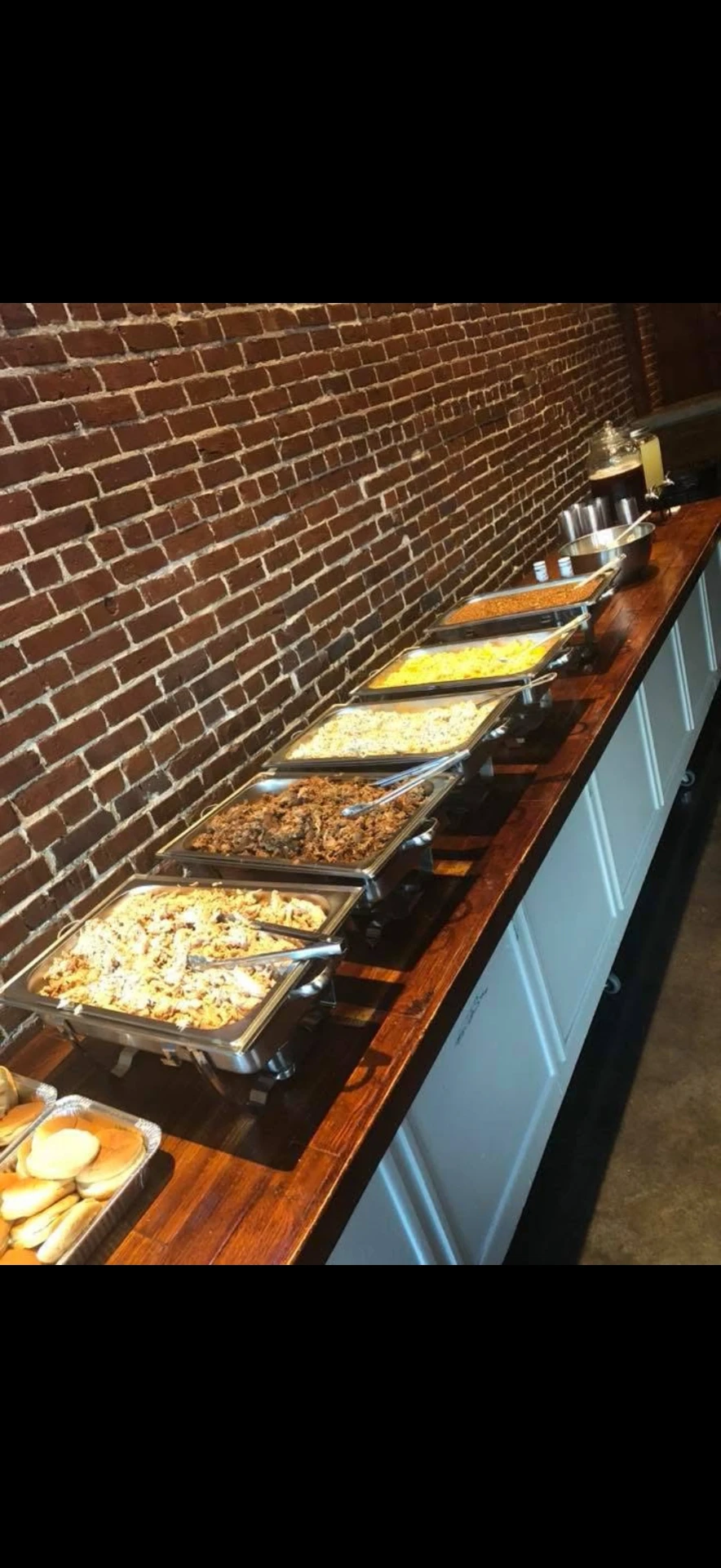 Catering buffet line with sides and pulled pork